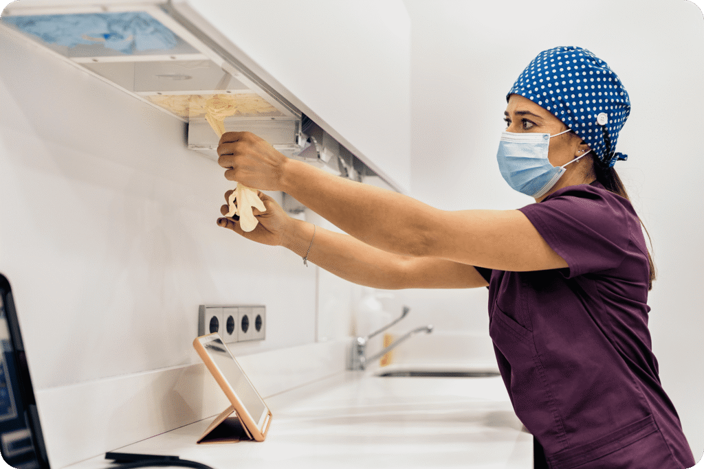 Professional cleaner sanitising a kitchen area during deep cleaning service in Darwin