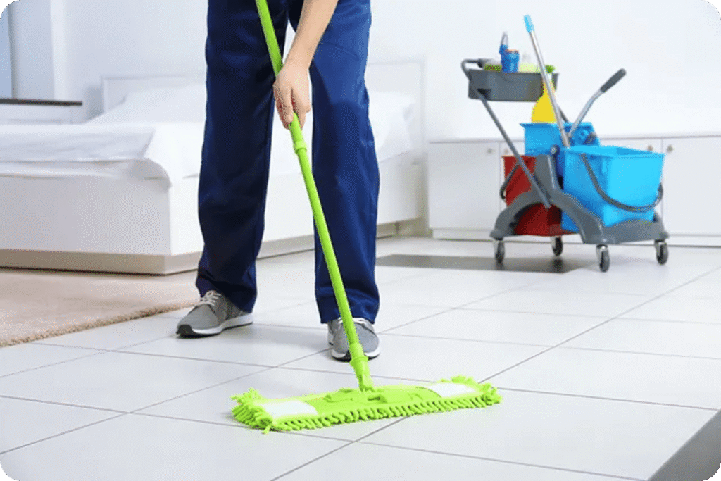 : Professional cleaner wiping surfaces and maintaining cleanliness in residential and commercial spaces in Darwin
